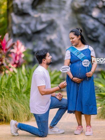 A fun and playful maternity shot with 'Coming Soon' and 'Let me out!' signs, adding a touch of humor to the photoshoot.