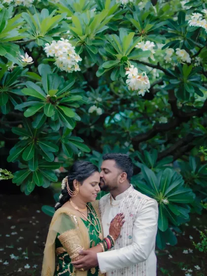 A tender moment shared between the couple during their outdoor engagement shoot. We use natural environments like this beautiful flowering tree to create a soft, romantic backdrop for your love story.