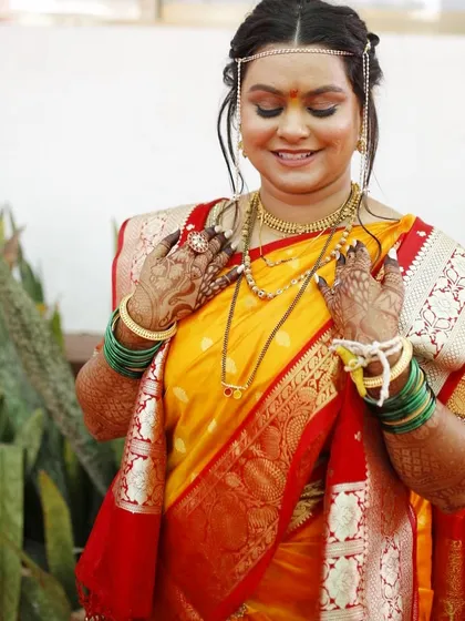 The pure happiness of a bride on her wedding day. This look for her Haldi ceremony features a yellow saree and glowing, natural makeup that lets her joy shine through.