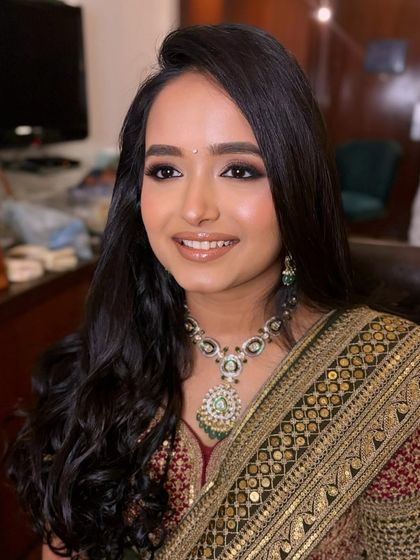 A close-up of the makeup for Simran. The focus is on a soft, brown smokey eye that beautifully defines her eyes.