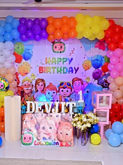A vibrant Cocomelon-themed home birthday setup, filling the living room with color and fun.