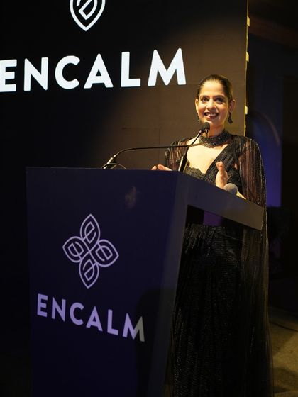Speaking at the Encalm annual event. The dark, elegant theme was reflected in the stage design and my attire.