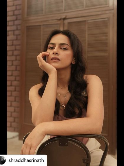 This pose highlights the soft textures of the outfit and the thoughtful, gentle mood we aimed to create for this particular photoshoot.