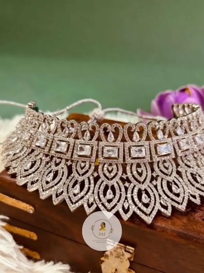 Our first exclusive AD jewellery collection features this broad choker necklace. The intricate design with leaf and square motifs gives it a very rich and luxurious feel.