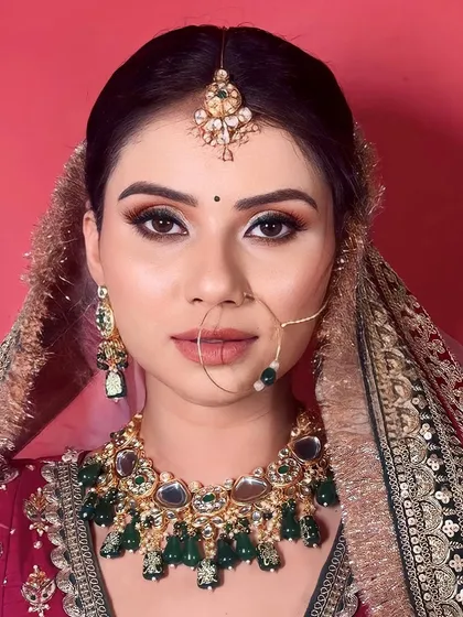 A close-up of the new-age regal bridal look we demonstrated in our seminar. The focus is on bold, defined eyes and flawless skin to complement the rich colors of the outfit.