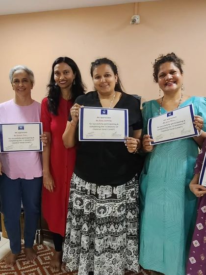 Proud students holding their certificates after completing the 12-session Classical Vocal course. We offer both online and offline options for this course.
