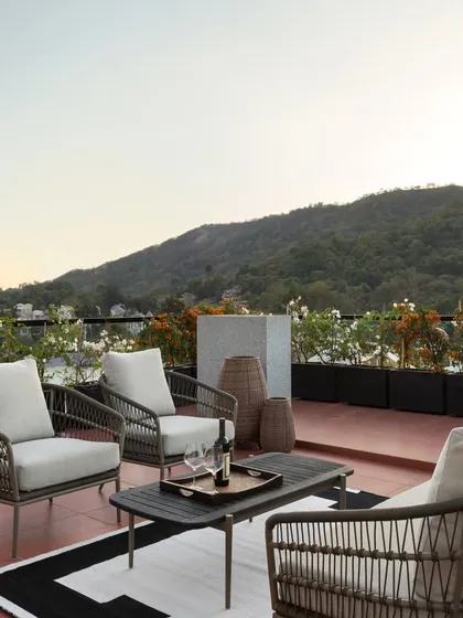 The rooftop terrace at the House of Terraces is an urban oasis. We designed this spacious outdoor area for entertaining, offering panoramic views of the adjacent national reserve and surrounding hills.