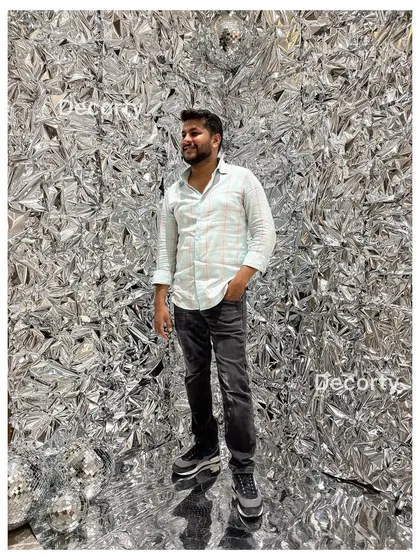 My foil backdrops are perfect for adding a touch of glamour to any party or corporate event. This silver wall creates a dynamic, textured photo booth that looks fantastic in pictures and gets everyone in the mood to celebrate.