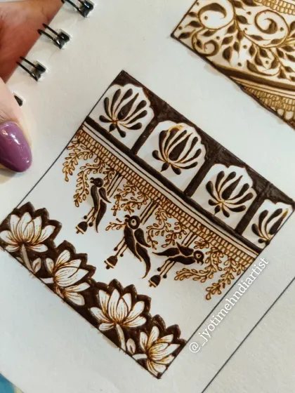 A practice sketch of a traditional pattern featuring hanging parrot motifs and lotus flowers.