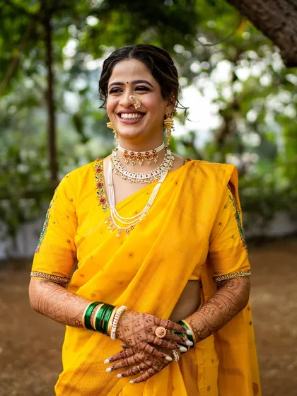 The bride's radiant smile says it all. The makeup is designed to make her feel confident and beautiful, glowing from within.