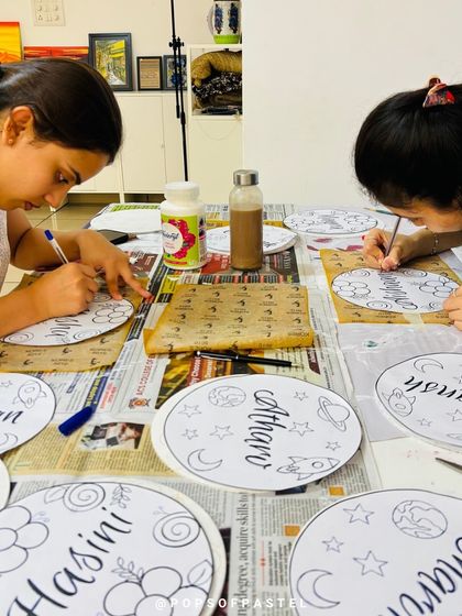 Behind the scenes of an art party. We're prepping personalized nameplates for each little guest to paint.