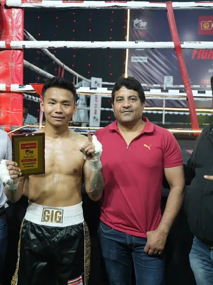 My team and I with a victorious boxer. We are a family that supports fighters from all corners.