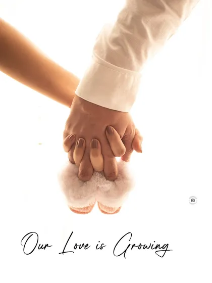 Sometimes the smallest details tell the biggest story. This close-up shot of hands holding tiny baby booties is a creative and emotional way to announce that your love is growing.