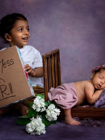 We always have a little fun during our sibling photoshoots! This big brother is already so protective of his little sister. This playful shot captures his personality perfectly and tells a sweet story about their future together.