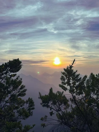 A stunning sunrise over the hills of Munnar.