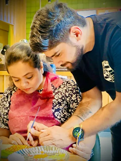 A couple enjoying a creative paint date. It's a wonderful way to spend quality time together, learning a new skill and making a shared memory.