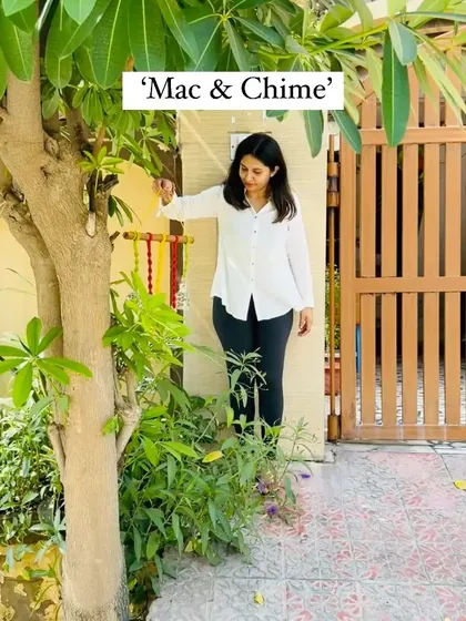 Welcoming 'Mac & Chime' to our collection. This wall hanging features intricately knotted colored cotton cords and hand-painted ceramic bells, adding a delicate touch of sound and elegance to any space.