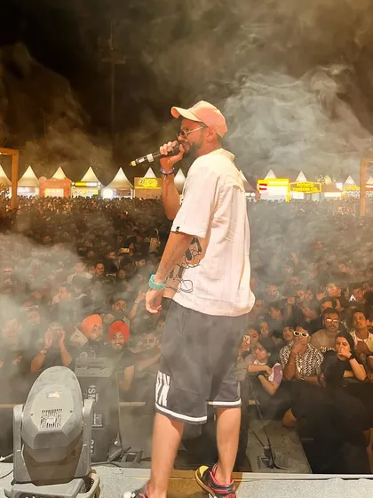 Mic in hand, smoke in the air, and a massive crowd in front of me at the Horn OK Please festival. This is the raw energy I bring to every public event and live show.