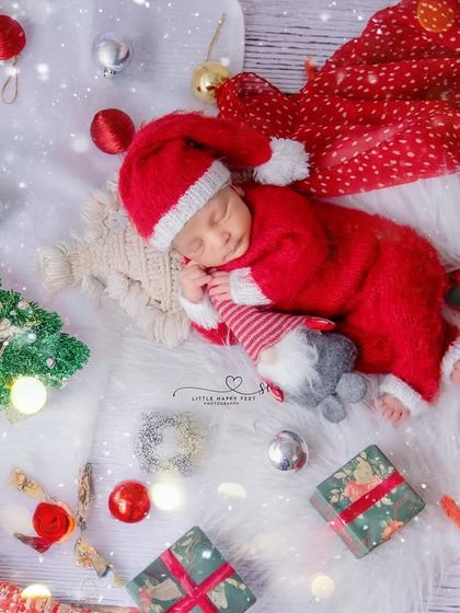 The best Christmas gift of all. This festive flat-lay, with the baby dressed as Santa, is a perfect image for your family's holiday card.
