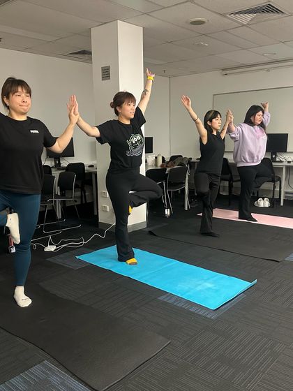 Another view of the tree pose (Vrikshasana) from my class at Gamma College in Melbourne. This pose is fantastic for improving focus and balance, essential skills both on and off the mat.
