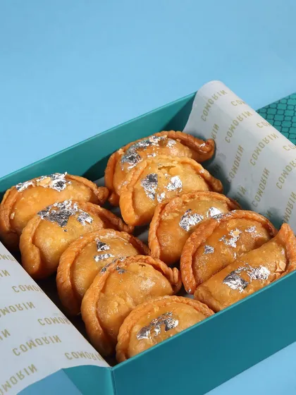 Our special Gujiya Boxes for Holi. These traditional sweet pastries are filled with khoya and nuts, making them a perfect festive gift or treat for your celebrations.