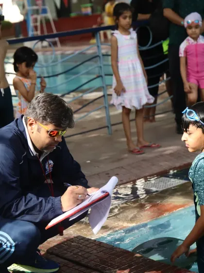 I take the time to speak with each swimmer before their race. Here, I am giving some last-minute advice at the Future Champions competition.