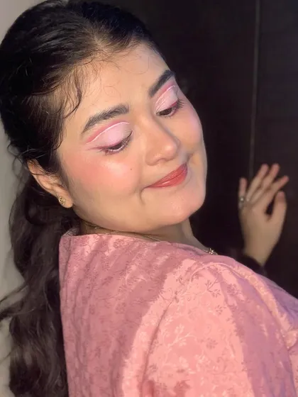 Pretty in pink. This look features a creative pink graphic liner.