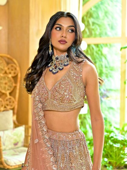 A close-up of the stunning reception makeup. The focus is on the beautifully blended eyeshadow and the flawless, glowing skin.