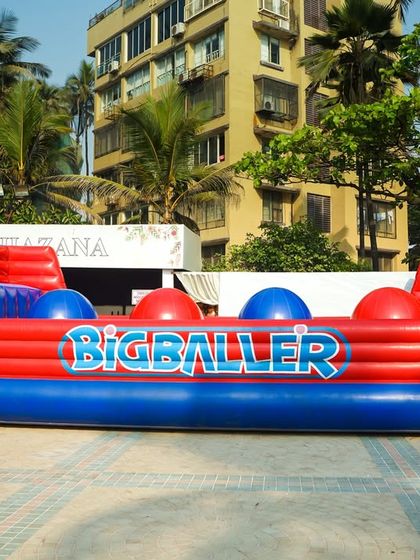 The 'Big Baller' inflatable is a challenging and hilarious game where participants try to cross by jumping over giant red balls.