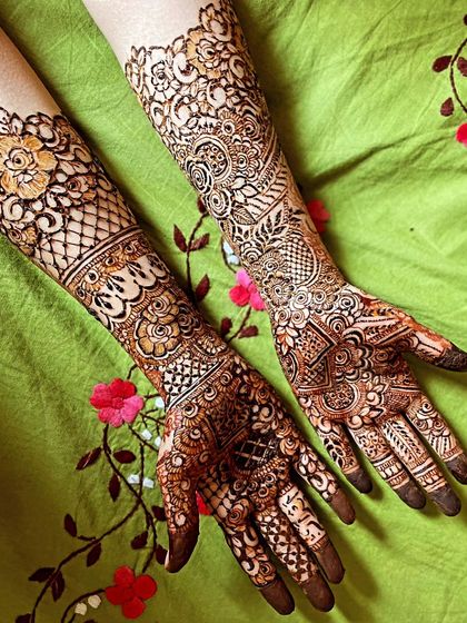Mehendi for my brother's wedding. This design has a mix of styles, with one arm featuring delicate florals and the other with more traditional patterns.