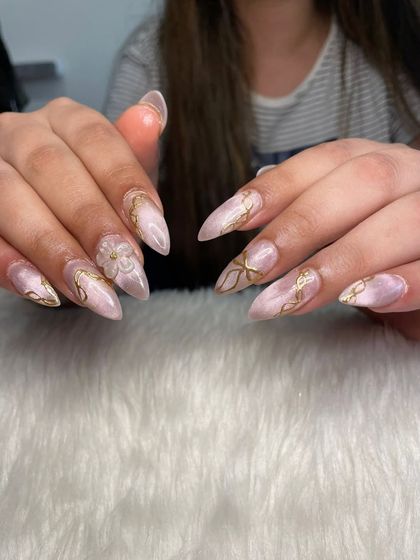 A perfect combination of pink cat eye, gold chrome swirls, and a 3D flexi gel flower.