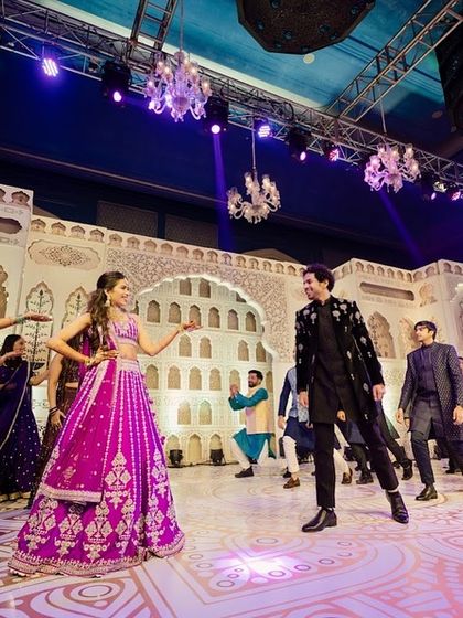 The sangeet night was filled with incredible family performances. The stage, with its traditional thikri work, provided the perfect backdrop for these cherished moments of dance and celebration.