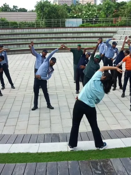 Leading the staff at Candor Techspace in a full-body stretch. Proper cool-downs are just as important as the workout, especially in large group settings.