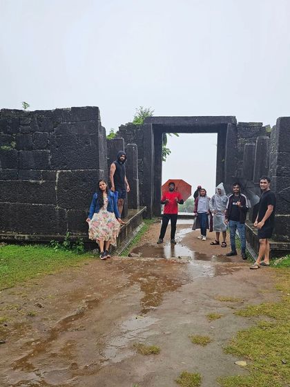 Our group exploring the ancient stone structures of Kavaledurga Fort during our Kodachadri trip.