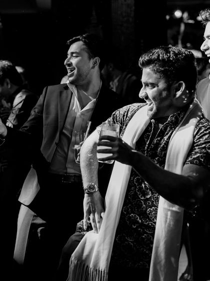 A black and white shot of guests lost in the music. Sometimes, stripping away the color reveals the raw emotion and energy of a moment.