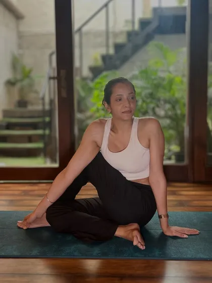A seated spinal twist helps to detoxify the body and improve spinal mobility, which can contribute to a stronger core.