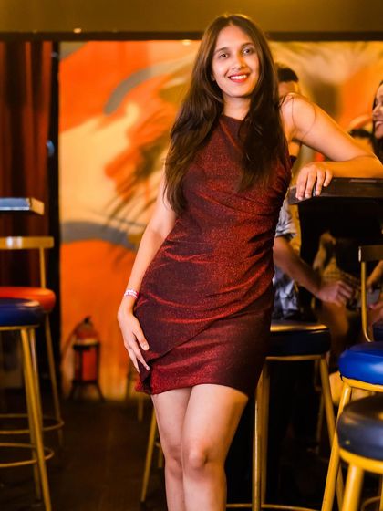 A guest in a shimmery red dress.