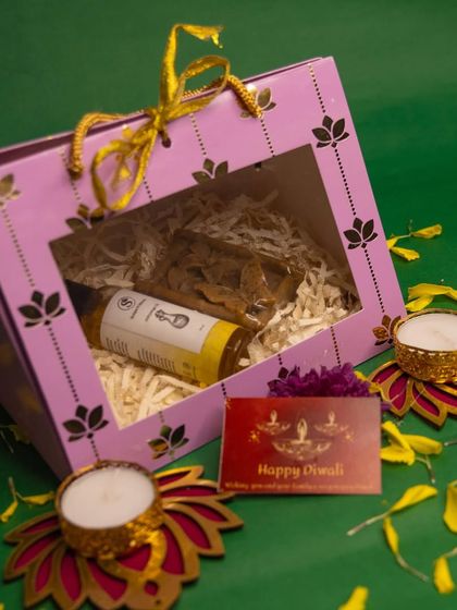A beautifully packaged Diwali hamper ready for gifting. This box contains a bottle of my handmade Abhyanga oil, perfect for a traditional festive wellness routine.