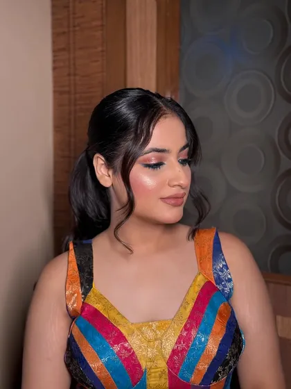 A fun and vibrant look for a party! The colorful dress is balanced with a soft glam makeup look, featuring a subtle smokey eye and a nude lip to keep the focus on the outfit.