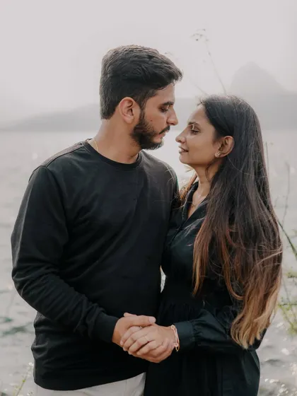A close-up of the couple sharing a meaningful look. The natural, soft lighting highlights their expressions and the quiet intensity of their connection.
