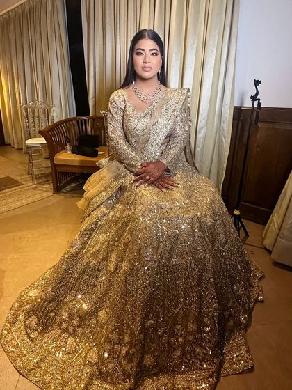The full effect of the golden lehenga and the complementary makeup. This look is pure modern bridal magic, designed to make a statement.