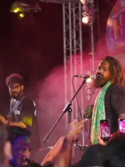 A shot from our Holi show in Pattaya. Covered in green, with the crowd's phones lighting up our performance.