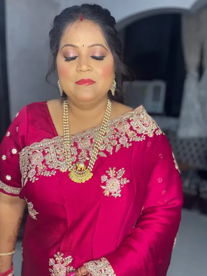 A dewy and fresh makeup look for my client. I used a shimmery eyeshadow and a glossy lip to create this vibrant look.