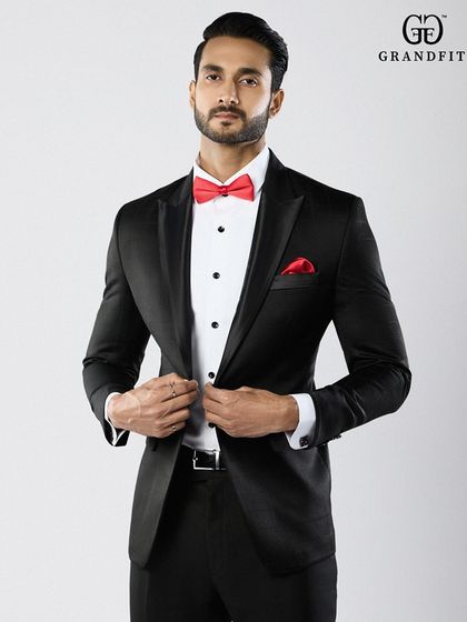 The precise fit of the jacket is paramount. This image shows how our tailoring creates a defined waist and a sharp silhouette, enhancing the wearer's frame.