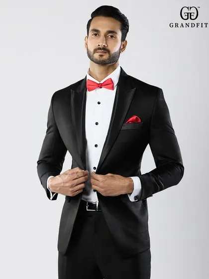 The precise fit of the jacket is paramount. This image shows how our tailoring creates a defined waist and a sharp silhouette, enhancing the wearer's frame.
