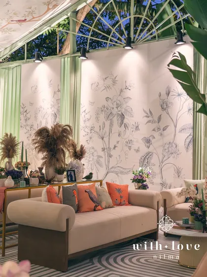 The lounge area of 'The Conservatory' at night, a chic and inviting space for guests.