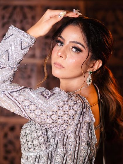 A complete look at my silver-grey geometric lehenga from a professional shoot. You can see the intricate details, the stylish back, and how it moves. It's a true work of art.