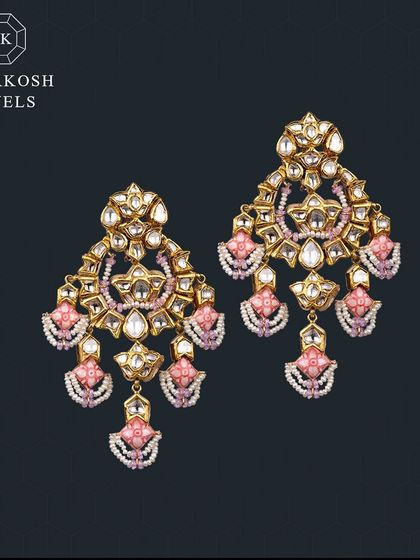 Sparkling with elegance and grace, these traditional polki and enamel earrings are the perfect touch for your unforgettable wedding day.