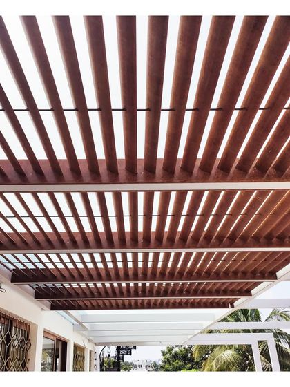 A detail of the wooden pergola on the terrace, creating a beautiful pattern of light and shadow.