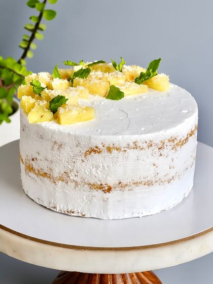 We’ve reimagined indulgence with our Naked Cakes. This image shows a variety of them, all crafted with premium ingredients and my philosophy of more cake, less cream.